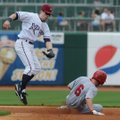 Northwest Arkansas’ Chris McConnell, left, tries to tag Arkansas’ Andrew Romine as he steals second ...