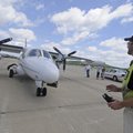Chris Kelsey, a line service tech at Fayetteville Executive Airport, prepares Friday to marshal a pl...