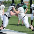 Bentonville offensive linemen Marcus Danenhauer, left, and Emerson DePeel clash Monday in Tiger Stad...