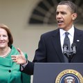 President Barack Obama stands with Small Business Administration Administrator Karen Mills as he add...