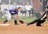 Fayetteville third baseman Rebecca Cantu tags out Bentonville’s Alex Cooper during a May 11 game in Bentonville.