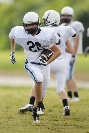 Springdale Har-Ber’s Blake Gary runs the ball during practice Thursday in Springdale.