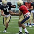 Shiloh Christian quarterback Kiehl Frazier hands off to running back Garrett Harper during practice ...