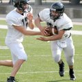 Bentonville running back Alberto Hernandez takes the handoff from quarterback Pearson Gean during sp...