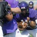 Fayetteville’s Brice Gahagans looks for space during Monday’s practice in Fayetteville.