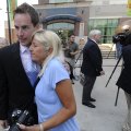 Jared Greer of Fayetteville hugs his mother-in-law, Angela Lehren, after a news conference Wednesday...