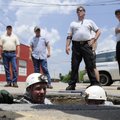 Springdale fire Capt. Todd Andrews, left, and driver/operator Justin Pinkley emerge from a storm sew...