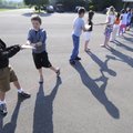  BOOK BRIGADE - Elkins Elementary School third- and fourth-graders pass books along a line Thursday ...