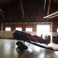  BACK TO THE ‘40s - Volunteers reposition a 1928 Travel Air Model R aircraft Thursday while preparin...