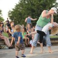 SUMMER CONCERT - Maggie Beason of Fayetteville and her 7-year-old daughter, Lola Beason, dance Thurs...
