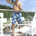  POOL PREP - Matt Fryauf of Rogers washes chairs Thursday at the Lake Atalanta Park swimming pool ne...