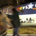 In this file photo from November 27, 2009, a shopper loads purchases into their vehicle after pre-da...