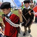  Matias Flowers, 5, left, and older brother Lucas sport traditional Argentinian gauchos while leadin...