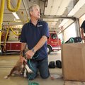 Rick Carthel, owner of Invisible Fence of Arkansas, left, demonstrates Thursday the use of a set of ...