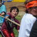  Nicandro Cabajal, 8, pulls a rope Friday during a tug-of-war game at Northside Elementary School in...