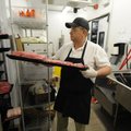  Jim Moser of Bentonville works Wednesday at the meat department of the Walmart Neighborhood Market ...