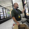  Walmart associate Chris Loucks stocks Great Value frozen food items May 4 at the Walmart Neighborho...