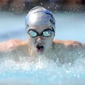  Samuel Schaefer, 14, competes in the boys 13-and-over 100-meter butterfly on Saturday during the Ne...
