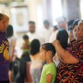 Raphailla Harris (from left), Vicklynn Ring, 7, and Vicklynn’s grandmother Katty Yamane, all of Spri...