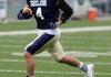 Shiloh Christian’s Garrett Harper carries the ball upfield during Tuesday’s practice in Champions Stadium in Springdale.