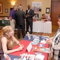 Farmers Insurance Group representative Djuana Mabry, left, talks with Doris Gomez during a Women’s D...