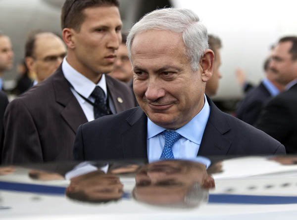 israeli-prime-minister-benjamin-netanyahu-is-reflected-in-the-roof-of-a-car-following-his-arrival-in-ottawa-on-sunday