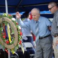 World War II naval veteran Oscar Valdez from Bella Vista and his son Mike Valdez of Siloam Springs p...