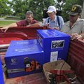Ron Pfeiffer, center, chief of the Marble Volunteer Fire Department, gets his department’s equipment...