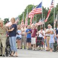 Roy Reynolds, a veteran of World War II, left, stands alongside his friend and “adopted granddaughte...
