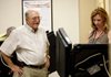  
Duane Neal of Bentonville (left) waits while election official Betsy Harrell of Pea Ridge starts the electronic ballot for him on Tuesday, June 1, 2010, inside the Benton County Administration Building in Bentonville. Early voting resumed for run-off elections on Tuesday.