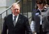  Arkansas Democrat-Gazette/William Moore
With his wife Linda next to him, Benton County Judge Dave Bisbee walks down the steps of the county courthouse before a press conference concerning his arrest Wednesday for ethics violations Thursday, April 22, 2010 in Bentonville.
