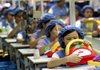 Workers assemble toy cars at a factory in Dongguan, China, in 2007. Recently young workers have been less willing than earlier generations to put up with bad working conditions.