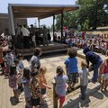 Children file outside Tuesday at Washington Elementary School in Fayetteville to celebrate the dedic...