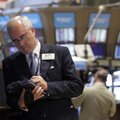 In this photo taken June 1, 2010, trader David McHugh works from the floor of the New York Stock Exc...