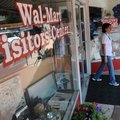 Marisol Velez with Walmart Puerto Rico leaves the Walmart Visitors Center on Wednesday while on a to...