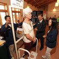 Shirley Prater of Prairie Grove, center, has her spinal alignment checked Wednesday by James Myshka ...
