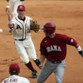 Arkansas second baseman Bo Bigham throws to first baseman Andy Wilkins after catching Alabama’s Jake...