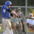 Rogers’ Travis Entwisle gets a hit for a two-run double Wednesday during the Merchants’ American Leg...
