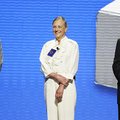 Jim Walton, from left, Alice Walton, and Rob Walton present the Entrepreneur Award on stage Friday J...
