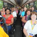 A bus full of Walmart associates from across the country arrive Thursday at the Bentonville square d...
