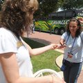 ASSOCIATES ARRIVING - Nancy Desler, left, with the Bentonville/Bella Vista Area Chamber of Commerce,...