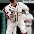 Arkansas’ Bo Bigham squares around to bunt against Wisconsin-Milwaukee on March 14 in Baum Stadium.