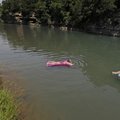 RIVER RELAXATION - Pamela Jackson, left, and daughter Brandi Acuff, both of Fayetteville, float Thur...