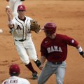 Arkansas second baseman Bo Bigham throws to first baseman Andy Wilkins after catching Alabama’s Jake...