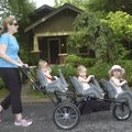 OUT FOR A STROLL - Amy Sweet walks her three children Thursday along South Fifth Street in Rogers. F...