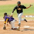 Grambling State’s Mychal Roby runs across home plate during the fourth inning as Alcorn State’s Davi...