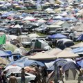 Music fans pitch tents Thursday in the main camping area of the Wakarusa music festival at Mulberry ...