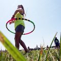 Jordan Abernathy of Fayetteville works a hula-hoop while enjoying the music of Eureka Springs band M...