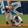 Arkansas shortstop Tim Carver forces out Vanderbilt’s Aaron Westlake at second base as he tries to t...