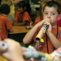 Students blow on the didgeridoos they made at last year’s vacation Bible school at First Baptist Chu...